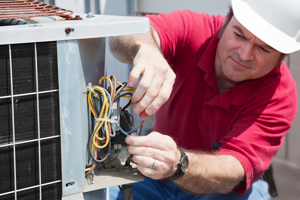 Quick Fix HVAC technician repairing a leaking air conditioner in Cleveland – Quick Fix HVAC Service
